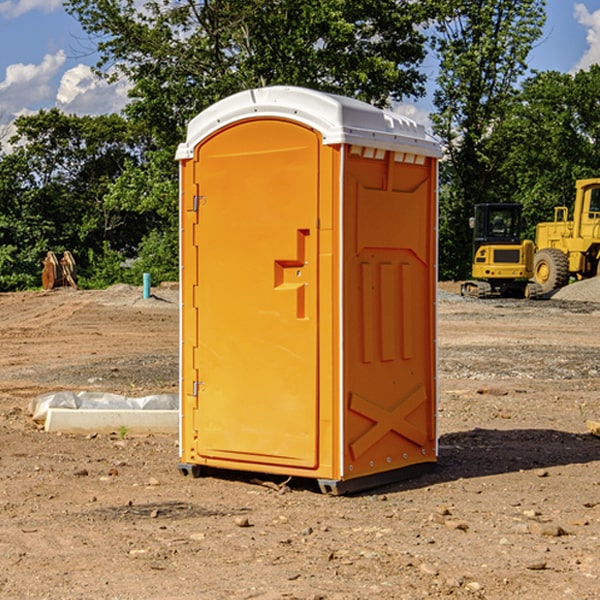 what is the cost difference between standard and deluxe porta potty rentals in Amana